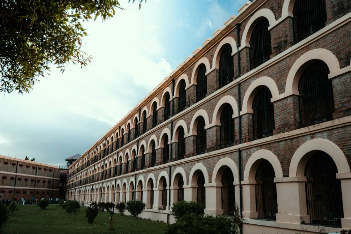Historic prison building with arched windows and courtyard